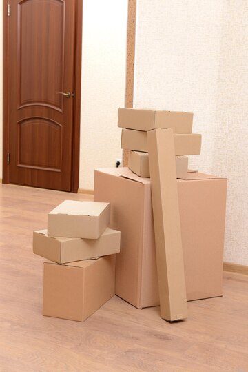 empty-room-with-stack-cartons-moving-house-concept_392895-297334